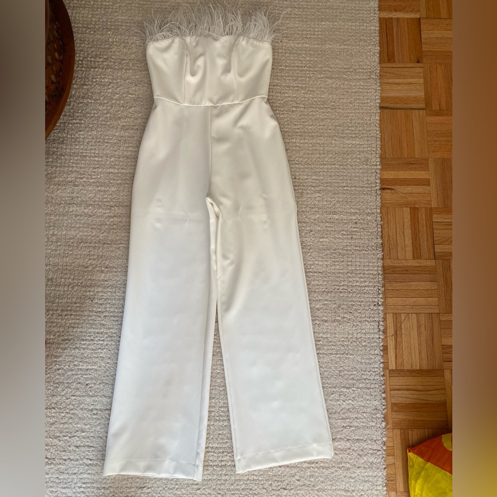 White Strapless Jumpsuit with feathers. Freshly dry cleaned. Wore once.